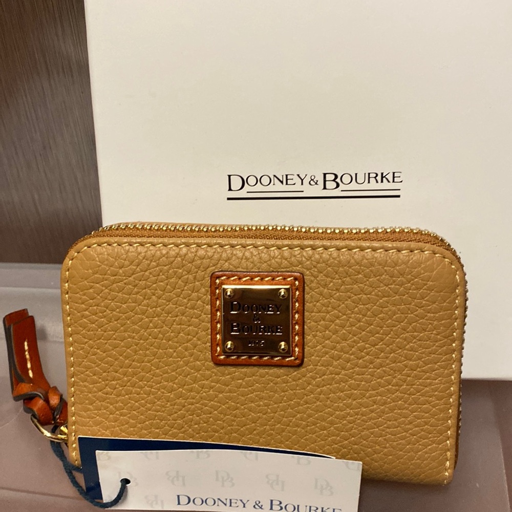 Dooney and Burke pebble grain large zips around credit card wallet. NWT …